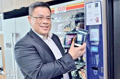 a man in a suit is using a vending machine