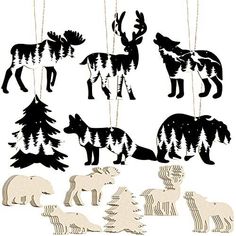 the silhouettes of different animals are hanging from strings