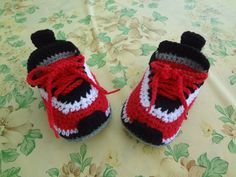 Handmade crochet baby sneakers will keep your baby's littler feet cozy and warm  Baby sneakers look beautiful and they are very comfortable These baby sneakers are available in a variety of color combinations.Just message me with your choice of colors Baby sneakers available in different size Newborn ( 3" L )  It is 8 cm 0-3  months  ( 3.5" L ) It is 9 cm 3-6 months   (4 " L ) It is 10 cm 6-9 months   (4.5 " L) It is 11 cm 9-12 months ( 5" L ) It is 13 cm If you see something you love but want a different size or color.I' d be happy  to create a custom order just for you Note   Every baby is different , so please measure the baby's foot before ordering the items Please contact me if you have any questions Thank you for checking out my listing and visit my shop. Baby Boots Crochet, Crochet Baby Sneakers, Crochet Baby Boots, Booties Crochet, Sneakers Looks, Wedding Gift Baskets, Crochet Baby Shoes, Crochet Baby Booties, Baby Sneakers