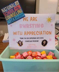 there is a sign that says we are bursting with appreciation in front of some candy