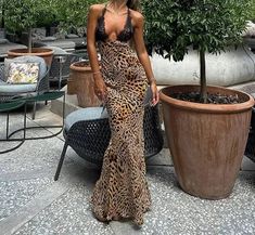 This summer, elevate your wardrobe with this stunning Lace Leopard Print Maxi Dress. Made with high-quality polyester fabric, this dress has a slight stretch for comfortable wear. The regular fit and straight silhouette flatter your figure, while the deep V-neckline and backless design add a touch of sensuality. The delicate lace detailing and ankle-length hemline bring a touch of elegance to this sexy and chic dress. Perfect for any occasion, this dress will surely turn heads and leave a lasting impression. Don't miss out on adding this dress to your collection - order now before it's gone! Fitted V-neck Backless Beach Dress, Fitted V-neck Backless Dress For Beach, Fitted V-neck Backless Summer Dress, Chic Stretch V-neck Backless Dress, Summer V-neck Backless Dress For Date Night, Summer Backless V-neck Dress For Date Night, Chic Fitted Backless Dress For Vacation, Fitted V-neck Backless Dress For Vacation, Summer V-neck Backless Dress For Night Out