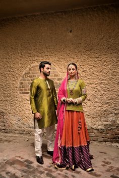 Obaid Sheikh Exclusive CollectionA color-block outfit with georgette Mukesh work and a bold, purple border, paired with a fuchsia pink chiffon dupatta with raw silk and embroidered flower motifs. Worn with a green kurti with raw silk, embroidered sleeves. Traditional Cotton Silk Lehenga With Dabka Work, Traditional Lehenga With Dabka Work In Cotton Silk, Traditional Dabka Georgette Sets For Ceremonies, Traditional Dabka Choli In Georgette, Straight Kurta Sets With Sheer Dupatta For Traditional Ceremonies, Pink Sets With Sheer Dupatta For Traditional Ceremonies, Raw Silk Sets With Sheer Dupatta For Traditional Ceremonies, Silk Salwar Kameez With Sheer Dupatta For Traditional Ceremonies, Green Cotton Silk Sets For Traditional Ceremonies