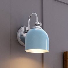 A gorgeous UHP4310 Vintage Wall Sconce 9''H x 5.5''W with a blue shade hanging on a wall, Urban Ambiance Jacksonville Collection. Light Powder Room, Outdoor Wall Light Fixtures, Modern Outdoor Wall Lighting, Vintage Wall Sconces, Indoor Wall Sconces, Bath Light, Wall Fixtures, Wall Light Fixtures, Vanity Lighting