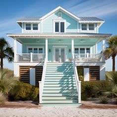 a blue and white house on the beach