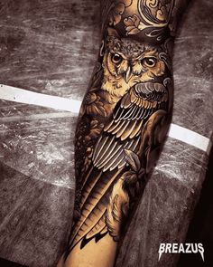 an owl tattoo on the arm and leg