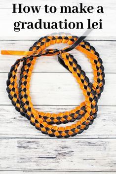 an orange and black braided graduation lei with the words how to make a graduation lei