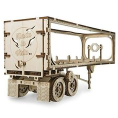 a wooden model of a truck with wheels