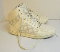 USED Features Coach Norra Spat High Top Sneakers Womens size 9.5 shoes Coach Sneakers White.  These shoes are used but in great shape see pictures for full condition.  these were my shoes and I wore them several times but they were not my main pair of shoes.  These shoes are Norra style from Coach Brand and #F0007/L08. IF YOU SELECT FREE OR CHEAPEST SHIPPING OPTION YOUR ITEM WILL SHIP IN PLASTIC BAG !!!!!!!!!!! THIS ITEM LISTING IS BUY IT NOW !!!!!!!!!!!!!!               PLEASE ASK ME ANY QUESTI Coach Sneakers, Coach Shoes, Sneakers White, Plastic Bag, Converse Sneaker, Womens Sneakers, High Top Sneakers, Converse, Womens Sizes