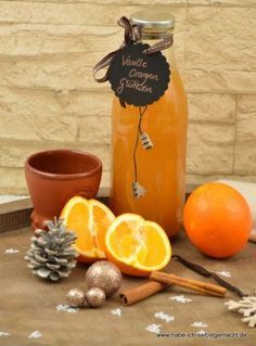 an orange is sitting on a table next to some spices