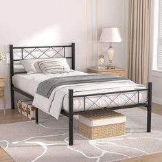 a bed room with a neatly made bed and two nightstands on either side of the bed