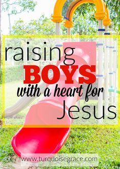 a red slide in the grass with text reading raising boys with a heart for jesus