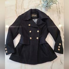 Guess Winter Coat- A Classic Staple That Will Last Years! Size Large Wool Blend Heavy & Warm Solid Black In Great Condition, No Flaws- Has Some Minor Pilling Long Sleeves With Button Detail Lined 27" Length From Shoulder 21 3/4" Underarm To Underarm 20" Across Bust 18 1/2" Across Smallest Part Of Waist Winter Office Peacoat With Buttons, Black Double-breasted Outerwear With Button Closure, Fitted Winter Pea Coat With Snap Buttons, Fitted Pea Coat With Snap Buttons For Winter, Black Winter Outerwear With Button Cuffs, Black Pea Coat With Snap Buttons For Winter, Black Winter Blazer With Button Cuffs, Black Double-breasted Peacoat For Winter, Fitted Black Pea Coat With Button Cuffs