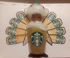 a starbucks drink with a turkey decoration on it