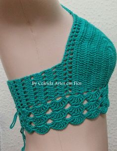 a crocheted top is shown on a mannequin