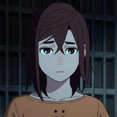 an anime character with brown hair and blue eyes looks at the camera while standing in front of a jail cell