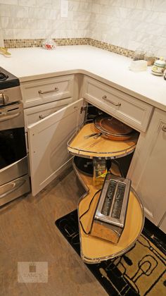 a kitchen with an oven, microwave and table in the corner next to the stove