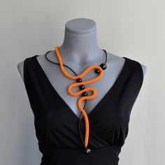 Gorgeous artist bold orange and black mesh necklace. Contemporary bohemian style necklace. Light breathable and comfortable necklace to wear. Necklace length around neck: 21"/ 55 cm Closure: Lobster claw Please send me a message if you have any questions or doubts. I will gladly answer to you. Search out my shop maybe you will find something for your loved ones or for you. Best regards Ivana. Unique Orange Long Necklace, Unique Orange Necklace For Party, Handmade Orange Necklaces For Party, Bold Handmade Necklace For Party, Bold Black Necklace For Gifts, Bold Black Necklace For Gift, Handmade Bold Necklace For Party, Bold Orange Party Jewelry, Contemporary Bohemian