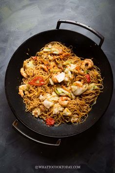 shrimp and noodle stir fry in a wok