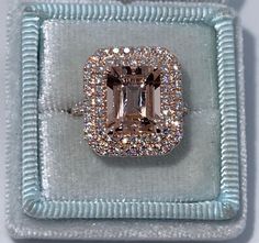 an engagement ring in a box with diamonds