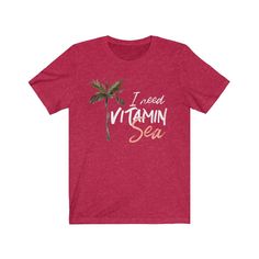 I need vitamin sea! Funny shirt. This beach tee makes a great beach lovers gift. A beach tshirt with a palm tree is beach chic and gives you a feeling of being on the beach, in the warm tropical breeze. Close your eyes and picture the swaying palm trees and the soft sand underfoot. Awww... Feel the vacation vibes in this unisex tee. It fits like a well-loved favorite. Super soft cotton and excellent quality print makes you fall in love with this tee over and over again. 🏝 Soft cotton (fibre con Beach Holiday Graphic Print T-shirt, Graphic Print T-shirt For Beach Holiday, Tropical Beach T-shirt For Beach Season, Tropical T-shirt For Beach Vacation, Tropical T-shirt For Beach Season Vacation, Letter Print T-shirt For Beach Season Holiday, Tropical T-shirt For Beach Party Vacation, Tropical T-shirt For Beach Party, Hawaiian T-shirt For Beach Party Vacation