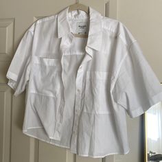 Never Worn Abercrombie Short Sleeve White Button Up! Cropped Fit, Crisp White, Very Lightweight, Perfect For Your Coastal Grandmother Summer Or Light Academia Fall! Cute Pockets On The Front Elevate The Simplicity Of It. Size Medium. White Button-up Tops With Buttons, Relaxed White Button-up Top, White Relaxed Fit Cropped Button-up Shirt, Unstructured White Button-up Top, White Button-up Top With Back Button Closure, White Button Up, White Button Down, Light Academia, Abercrombie Fitch