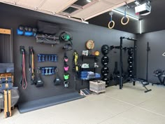 a gym with various equipment hanging on the wall