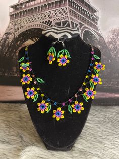 Beautiful set of necklace style flower choker with earrings, handmade by Mexican artisans. Handmade Flower Shaped Jewelry For Festivals, Handmade Flower Necklace For Festivals, Bohemian Multicolor Flower Decoration Jewelry, Flower-shaped Matching Earrings For Festivals, Multicolor Handmade Flower Jewelry, Handmade Flower Choker For Gift, Flower-shaped Jewelry With Matching Earrings For Festivals, Handmade Flower Choker As A Gift, Handmade Adjustable Flower Necklace