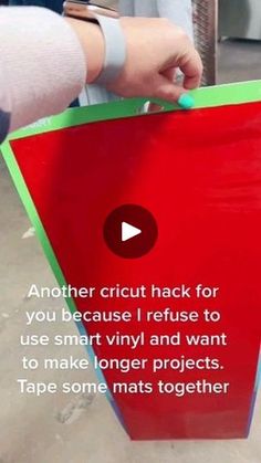 a person holding a piece of paper with the words another cricut hack for you because i refuse to use smart vinyl and want to make longer projects tape some mats together