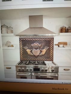 a stove top oven sitting inside of a kitchen