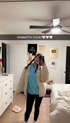 a woman taking a selfie in her bedroom with the caption that reads, i love you mom