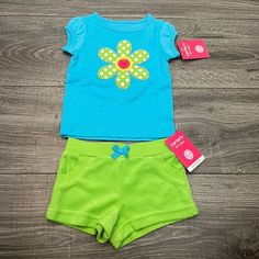 Carters Lets Play 2pc Matching Set Includes Aqua Blue Tee With Daisy Applique And Felt Pink Heart And Matching Coordinating Green Terry Shorts With Pockets And Elastic Waist. Comes From My Daughters Closet And Our Smoke And Pet-Free Home. Shop My Other Listings For More Apparel, Shoes, Accessories, And Other Treasures. Thank You For Shopping! Blue Cotton Short Set For Playwear, Cotton Short Set For Playtime In Spring, Cotton Short Set For Spring Playtime, Cute Blue Cotton Set, Playful Light Blue Cotton Sets, Playful Short Set For Spring Playtime, Cute Light Blue Sets For Playwear, Blue Short Sleeve Short Set For Spring, Cute Blue Playwear Sets