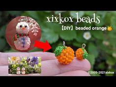 an orange and white beaded snowman earrings on someone's finger with the words, fixor beads diy beaded orange