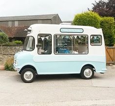 an ice cream truck is parked in the driveway