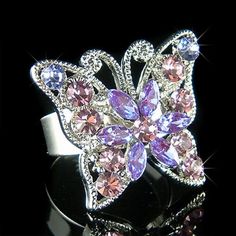 "PERFECT GIFT /WEDDING GIFT FOR BRIDE / BRIDESMAID / LADY! You are getting one adjustable Swarovski Crystal / Rhinestone BUTTERFLY ring. The ring measure 1 1/16\" wide X 1\" high (26mm X 25mm) Crystal Color: Light Amethyst, Tanzanite Ring size: 8 1/2 (US Size) Prices are in US$. For shipping policies and other important information, click on \"profile\" on the right. See an item that you like but has already been sold? Contact me to see if I have more! Thank you for stopping by Kashuen Collectib Sparkling Christmas Wedding Jewelry, Sparkling Purple Jewelry Gift, Silver Butterfly Ring For Parties, Sparkling Purple Jewelry For Gift, Pink Crystal Ring As A Gift, Wedding Jewelry With Bling For Valentine's Day, Valentine's Day Wedding Jewelry With Bling, Purple Rhinestone Jewelry For Anniversary, Purple Rhinestones Jewelry For Anniversary