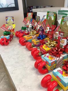 a table topped with lots of different types of gifts and presents on top of each other