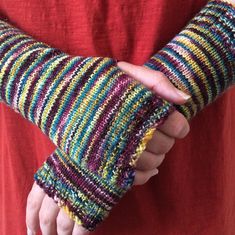 a person wearing a colorful striped arm warmer