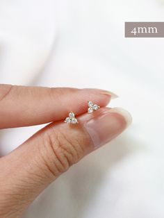 "Tiny trefoil stud earrings in 3 sizes, micro, tiny and little! Sold as a SINGLE (choose options above). PAIRS available here: https://www.etsy.com/listing/827255104/ An everyday staple for the modern minimalist. Hand set faceted cubic zirconia. Butterfly backings. Packaged in a beautiful gift box. Perfect for standard lobe piercings and small enough to be great stacking pieces for 2nd and 3rd piercings. NOTE: the claws holding the stone for the LITTLE size are slightly different and don't have 2nd Ear Piercing Ring, Dainty Cubic Zirconia Cluster Earrings, Delicate 14k Gold Cartilage Earrings, Dainty Cubic Zirconia Jewelry, Dainty Tiny Sterling Silver Cartilage Earrings, Tiny Cubic Zirconia Minimalist Cartilage Earrings, Tiny Dainty Cartilage Earrings, Minimalist Cluster Earrings As Gift, Dainty Gold Cluster Earrings