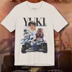 Rev up your style with the Yuki Tsunoda Graphic F1 T-Shirt, a must-have for fans of the talented racing sensation and motorsport enthusiasts. This meticulously designed tee features a captivating graphic of Yuki Tsunoda, celebrating his racing prowess on the track. Crafted with premium materials, the Yuki Tsunoda Graphic F1 T-Shirt offers both comfort and style. A must-have addition to your F1 collection, it's the perfect way to show your support for Yuki Tsunoda in a fashionable and unique mann Casual Crew Neck Tops For Motorsport Events, Casual White Tops For Motorsport Events, Casual T-shirt With Letter Print For Motorsport Events, Cute F1 Merch, Casual Short Sleeve T-shirt For Motorsport Events, F1 Polo Shirt, F1 T Shirt Design, F1 Tshirt Designs, Motorsport Clothing