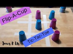 the tic - tac - toe game is being played with plastic cups