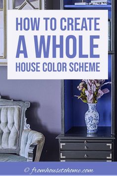 a blue and white vase sitting on top of a table next to a book shelf