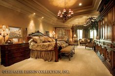 a large bedroom with lots of furniture and decor on the walls, along with a chandelier