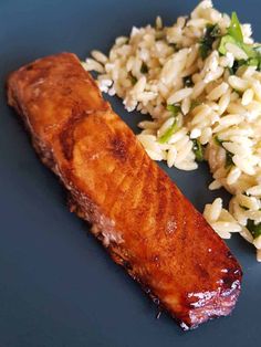 the meal is prepared and ready to be eaten on the plate with rice, broccoli and meat