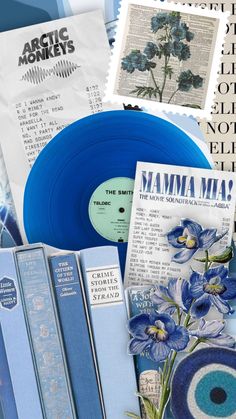 blue vinyl records and books are on display