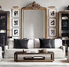 a living room filled with furniture and a large mirror