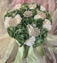 a bridal bouquet with green and white flowers