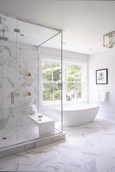 a bathroom with a tub, sink and shower stall in the middle of the room