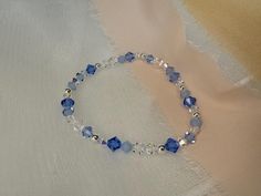 A luxurious, eye-catching, handmade stretch bracelet made using high-quality, lead-free, glass-cut crystals - made in the Czech Republic - renowned for their superior level of sparkle and brilliance.  Your something blue for your wedding day * This bracelet is so sparkly & will be sure to draw attention. The bracelet looks beautiful either on its own or stacked with others. The bicone shape, paired with the variety of finishes on the beads create a unique and super sparkly effect. This bracelet Blue Crystal Bracelet With Faceted Beads, Blue Faceted Crystal Bracelets, Elegant Blue Hand-strung Crystal Bracelet, Elegant Blue Stretch Bracelet With Faceted Beads, Handmade Blue Crystal Beaded Bracelets, Adjustable Faceted Blue Crystal Bracelet, Elegant Adjustable Light Blue Crystal Bracelet, Elegant Light Blue Adjustable Crystal Bracelet, Blue Faceted Beaded Bracelets For Gift