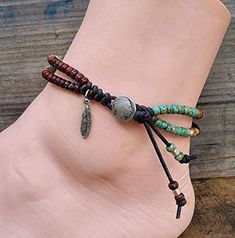 This one of a kind anklet was created using beautiful picasso style seed beads in rustic red, turquiose, and brown matte jasper along with brushed silver beads. They have been beaded on natural distressed antique brown leather. It also features a silver feather charm. I used an indian head button.  This anklet measures 9" to the start of the first loop.  Please Note - Due to the differences in computer monitors and cell phones there may be some variation in stone colors. I do my best to show their true color.  Need a different size? Please send me a message. I would love to make you a custom anklet providing I have the material to make one. All bracelets are handmade in beautiful Wild and Wonderful West Virginia.  Caring for your bracelet: To extend the life of your purchase, please refrai Picasso Style, Beaded Leather Wraps, Indian Head, Silver Feather, Feather Charms, Ankle Bracelet, Unisex Jewelry, Bead Leather, Computer Monitors