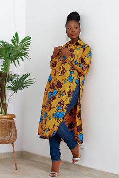 Looking for a bold African Piece that will turn heads? If so, this for you. Shirt is long, and free at the both sides. Buttons runs down from the collar neckline to bottom. Can be worn with or without the detachable belt, trousers or shorts, boots or heels; just as you please. Give yourself the look and confidence you deserve and get this exquisite fit today! NB: Leather belt is sold seperately. FEATURES. * 100% African Wax Cotton * Long sleeves which compliments the season. * A detachable match Kitenge Jackets, Kente Outfits, Shorts Boots, African Tops, African Print Tops, African Print Dress Ankara, African Dresses Modern, Ankara Fashion