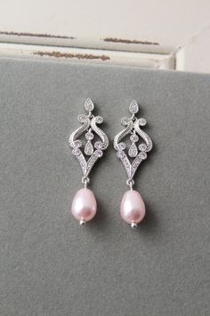 Wedding earrings with pearl  Bridesmaid Earrings  Pink  Wedding Jewelry Prom jewelry for her ❤  Vintage style  earrings Colour:  silver tone-rhodium/clear or rose gold tone/clear with lt.ivory or pink pearls Stud  earrings. Measurements: approx  4.4 cm (not long).  Materials: all components rhodium over brass, zircon  crystals, rosaline pink or white/lt.ivory faux pearls. Great for wedding or other celebration. MORE ACCESSORIES: https://www.etsy.com/uk/shop/ArtDecoByDonatale?ref=hdr_shop_menu ※ Rose Gold Pink Wedding, Pink Wedding Earrings, Gold Pink Wedding, Pearl Drop Bridal Earrings, Bridal Earrings Rose Gold, Drop Bridal Earrings, Pearl Drop Earrings Bridal, Bride Vintage, Rose Gold Bridal Earrings